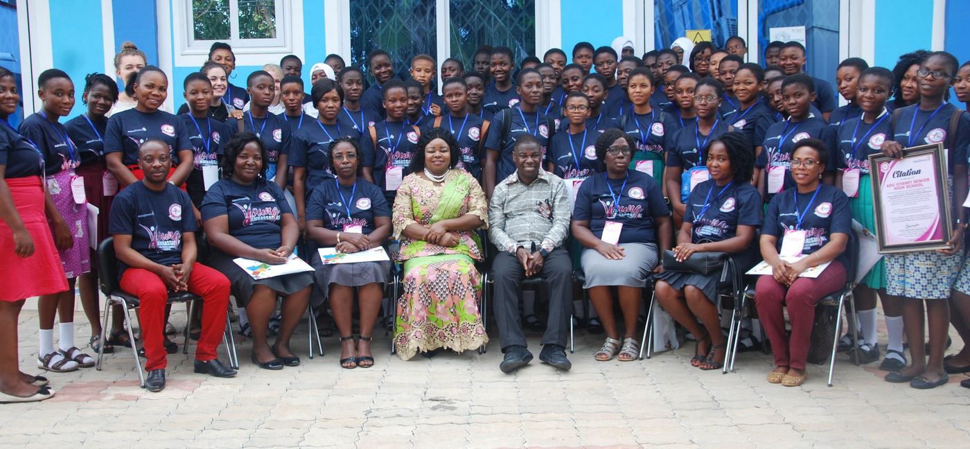 YABCA graduation group photo — trained student ambassadors in programme t-shirts with their tutors